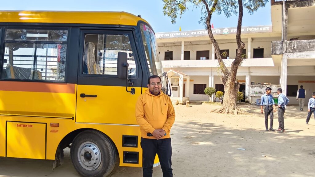 The college's yellow school bus parked in the courtyard in front of the main teaching block at Surajkunda.