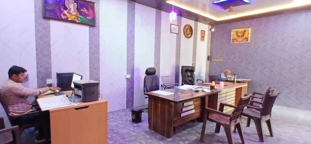 The administrative office of the college, with the clerk's workstation on one side and the principal's desk and visitor chairs on the other.