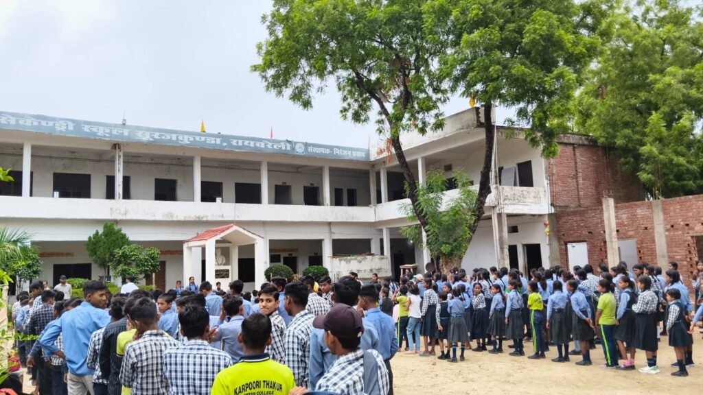 Students of Karpoori Thakur Inter College lined up class by class for the morning assembly in the courtyard in front of the main building.
