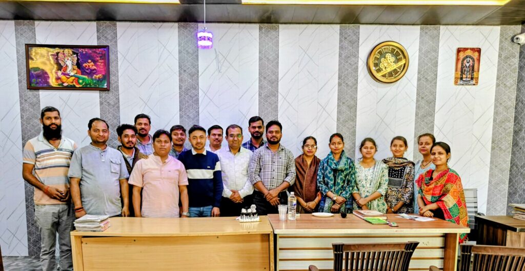Teachers and staff of Karpoori Thakur Intermediate College assembled for a group photograph in the college hall