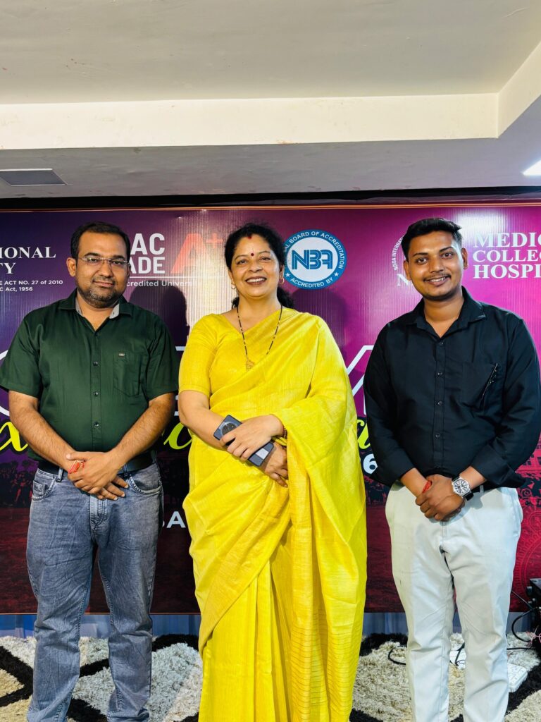Two representatives of Karpoori Thakur Inter College with a guest at an external university and medical college event.