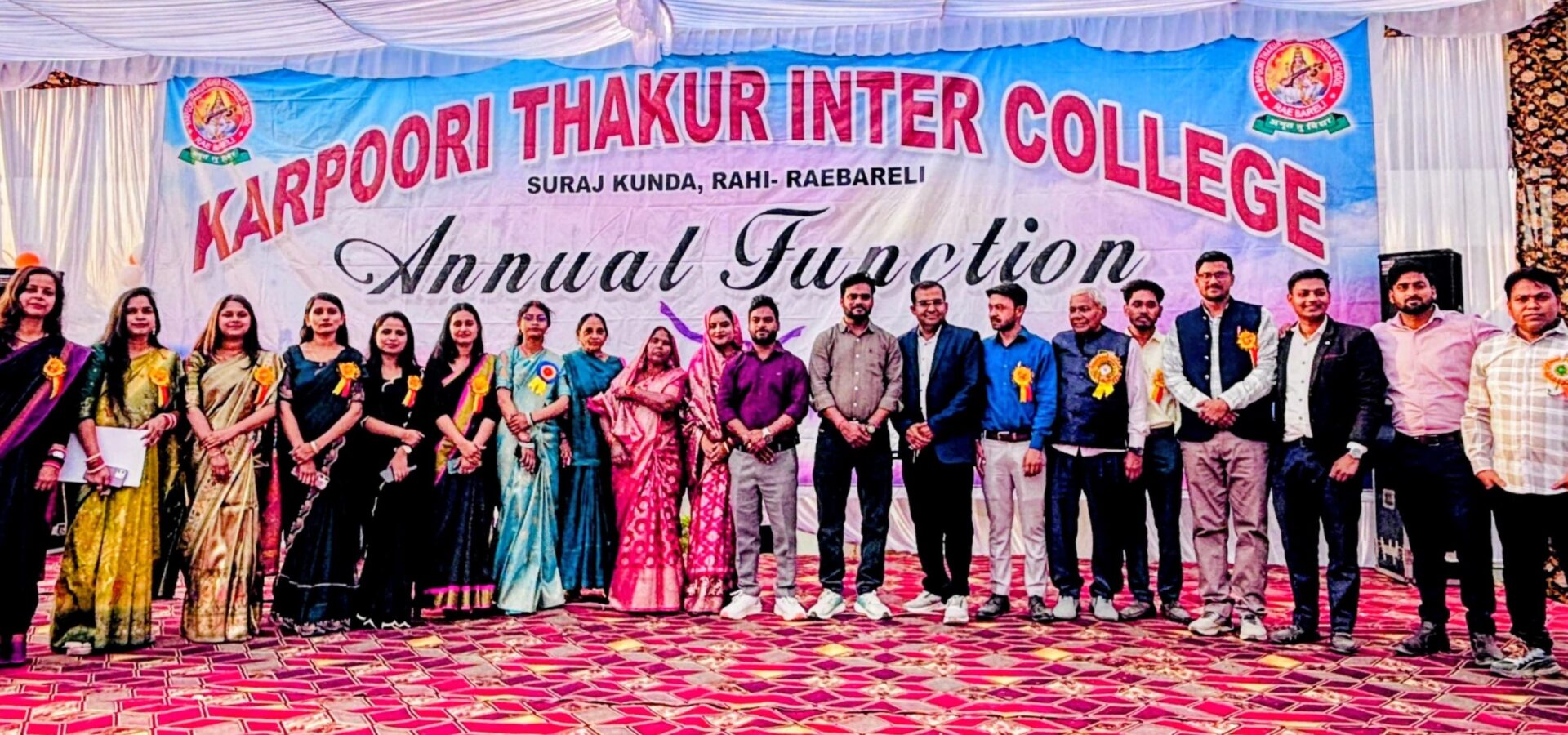 Staff and guests on stage beneath the Annual Function banner at Karpoori Thakur Intermediate College