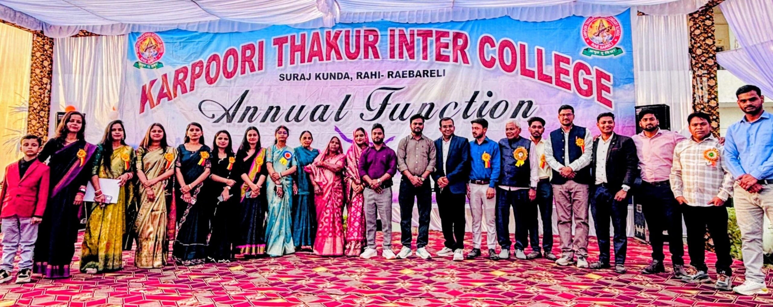 Staff and guests on stage beneath the Annual Function banner at Karpoori Thakur Intermediate College