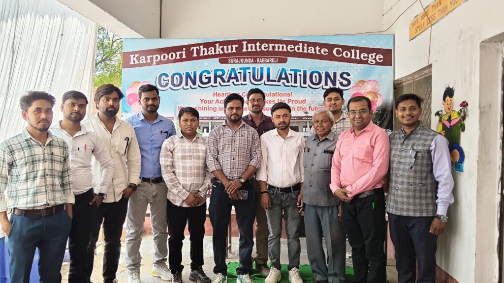 Teachers and staff of Karpoori Thakur Intermediate College standing beside a Congratulations banner for the students' results