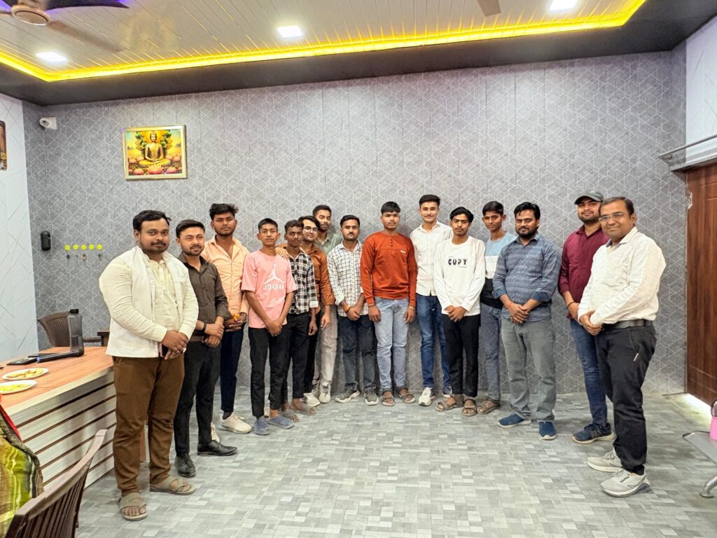 A group of senior students of Karpoori Thakur Inter College standing with staff in the college office after being honoured for their board results.