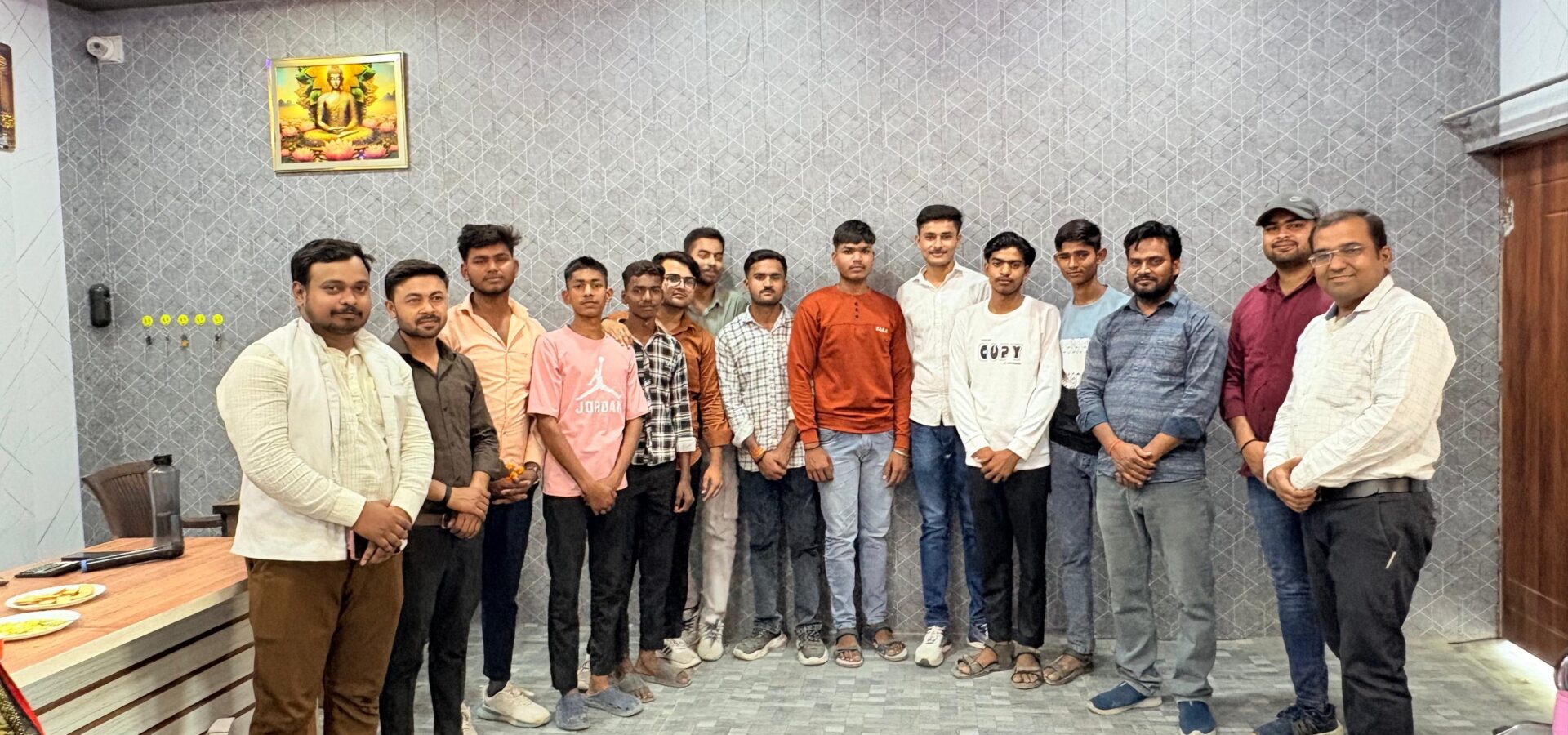 A group of senior students of Karpoori Thakur Inter College standing with staff in the college office after being honoured for their board results.
