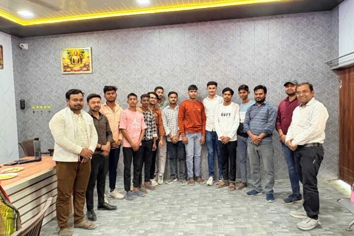A group of senior students of Karpoori Thakur Inter College standing with staff in the college office after being honoured for their board results.