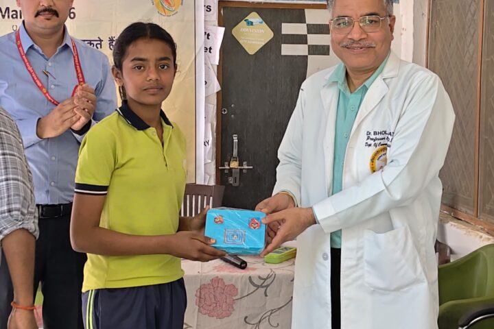 Student receiving an achievement certificate at Karpoori Thakur Intermediate College