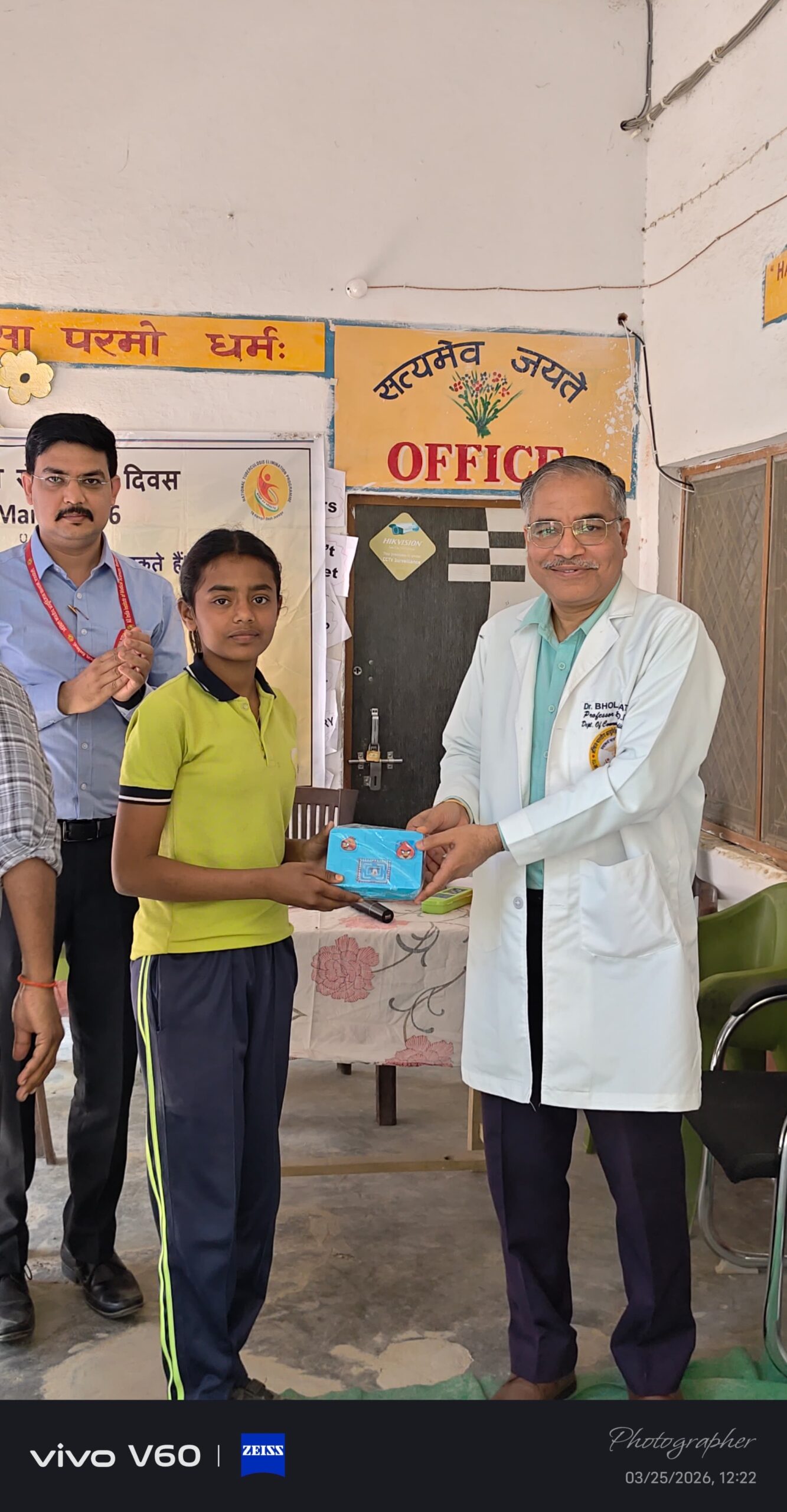 Student receiving an achievement certificate at Karpoori Thakur Intermediate College
