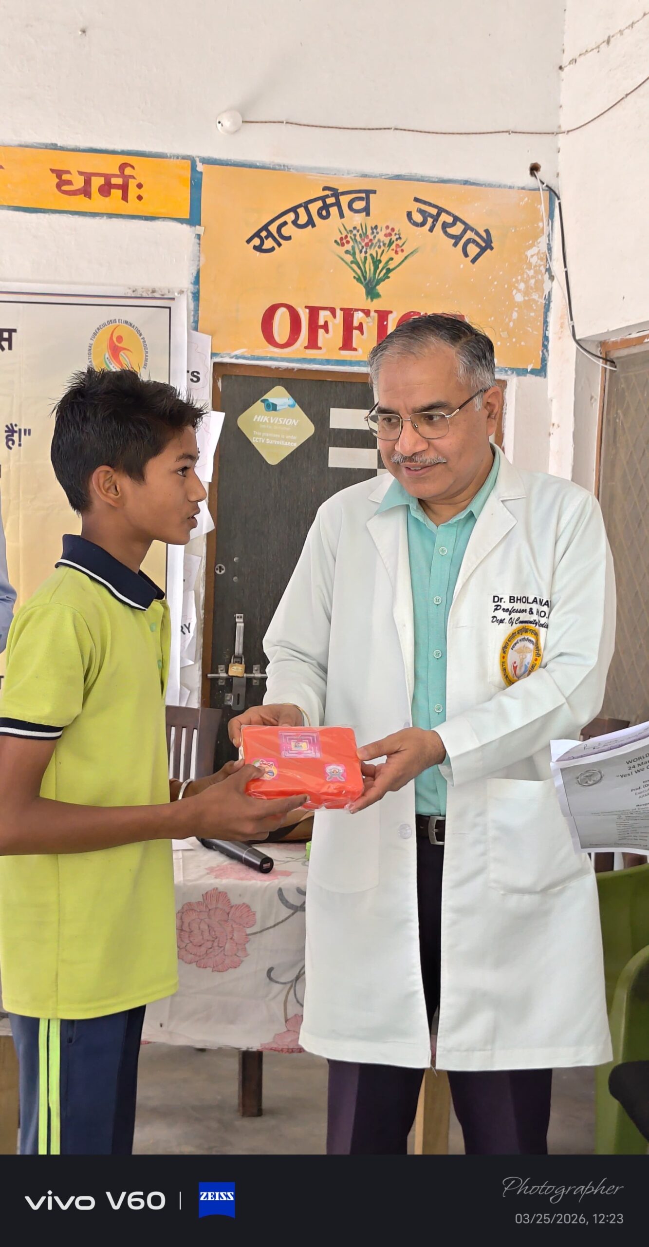 Student receiving an achievement certificate at Karpoori Thakur Intermediate College