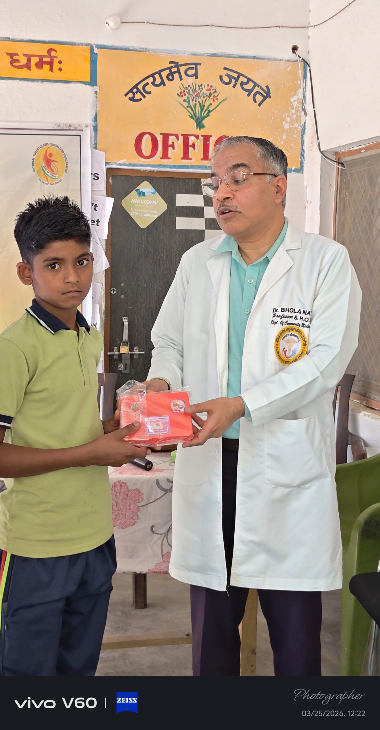 Student receiving an achievement certificate at Karpoori Thakur Intermediate College