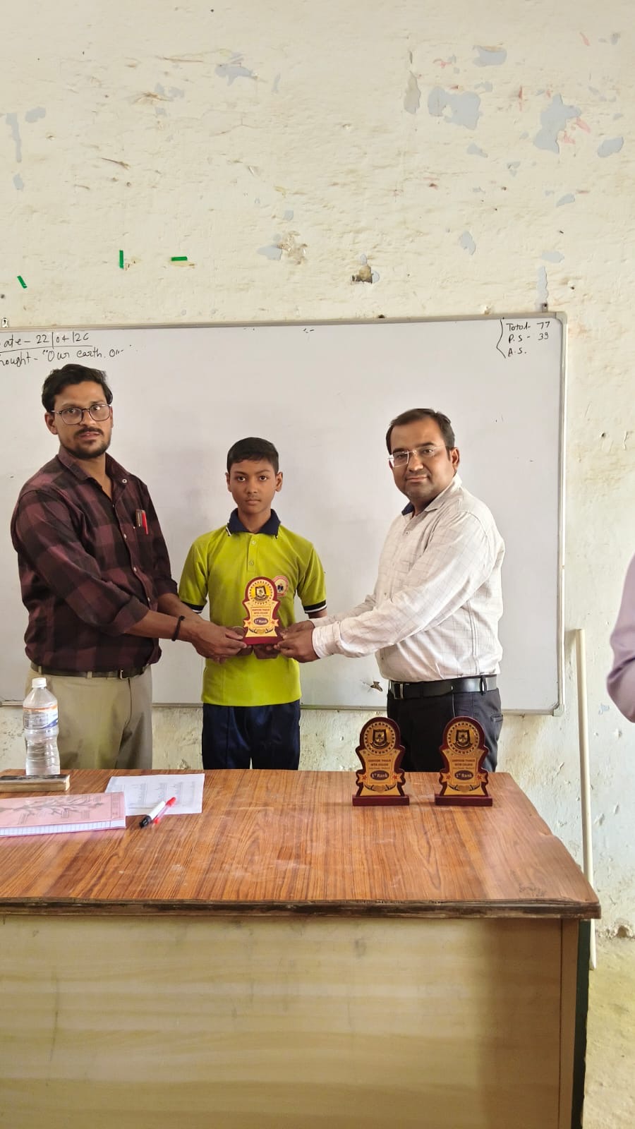 Student receiving an achievement certificate at Karpoori Thakur Intermediate College