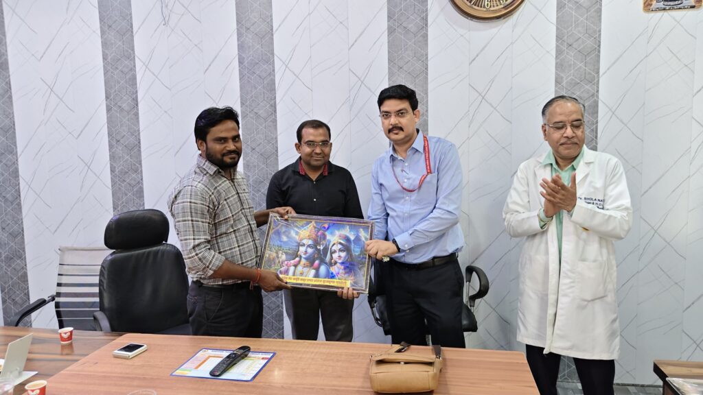 School staff presenting a framed memento to a visiting doctor after the World TB Day awareness programme